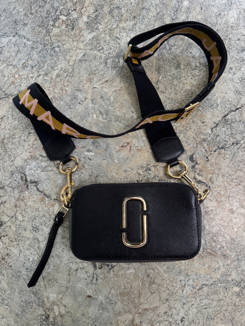 Marc Jacob’s Black Snapshot Bag with Gold Hardware and Branded Strap